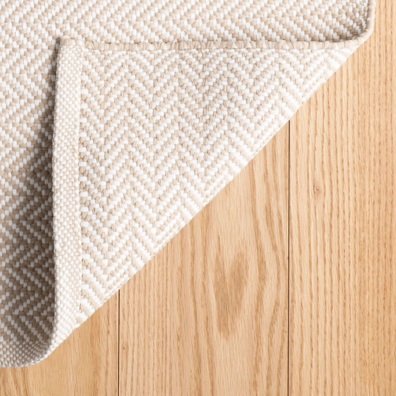 herringbone handwoven indoor/outdoor rug | linen/white herringbone handwoven indoor/outdoor rug | linen/white