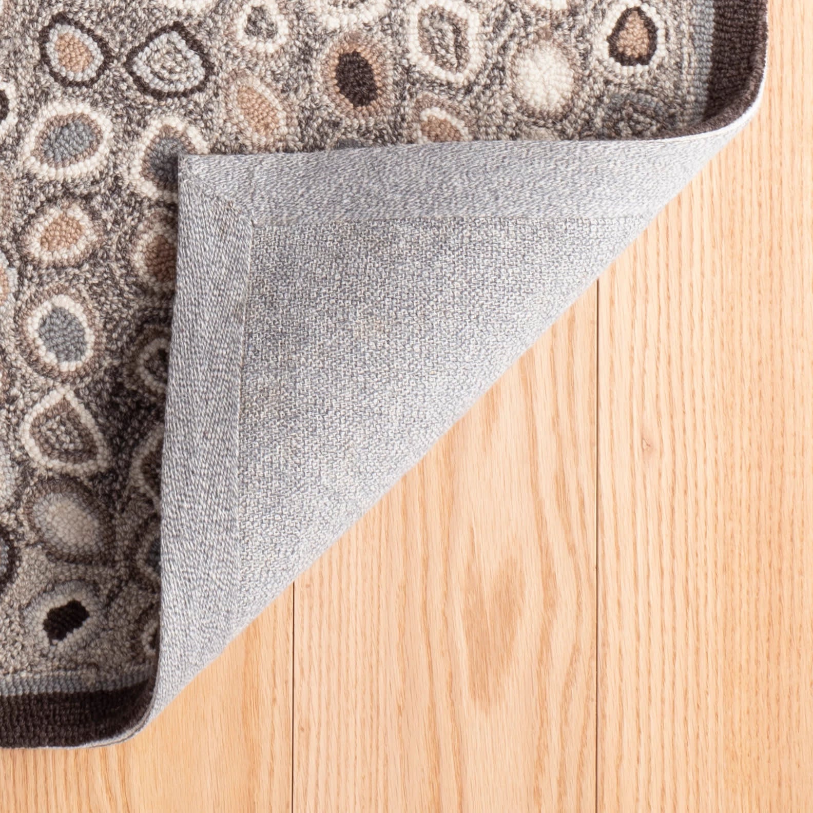 cat's paw hand micro hooked wool rug | grey cat's paw hand micro hooked wool rug | grey